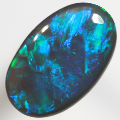 SOLID BLACK OPAL Bright electric peacock coloured roling flashes 